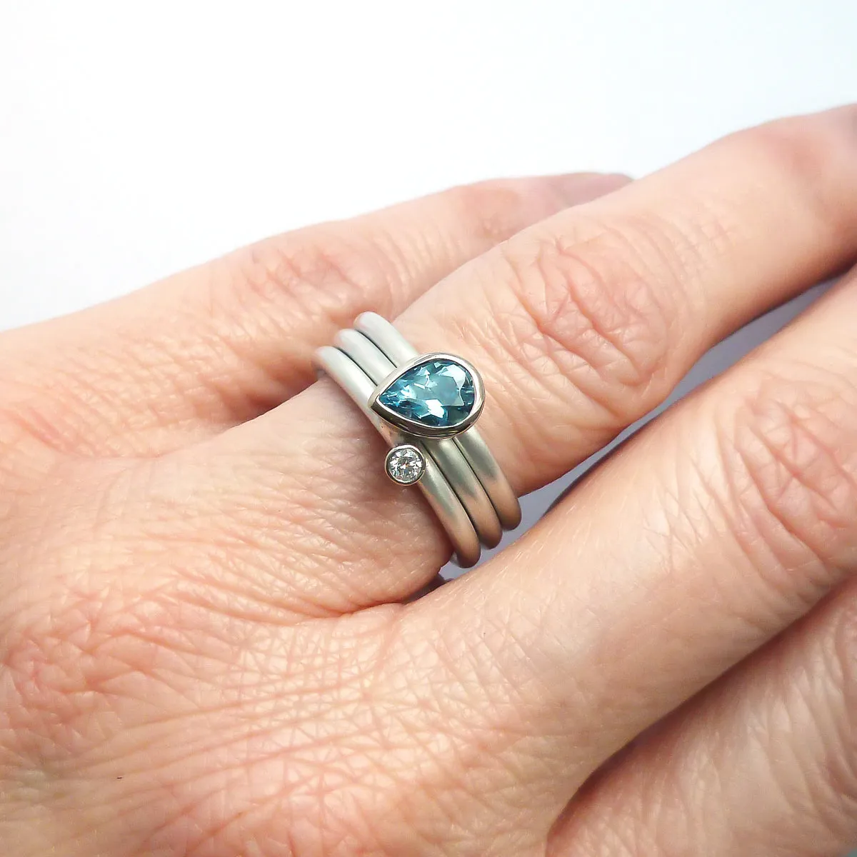 A unique, contemporary aquamarine and diamond gold and silver ring