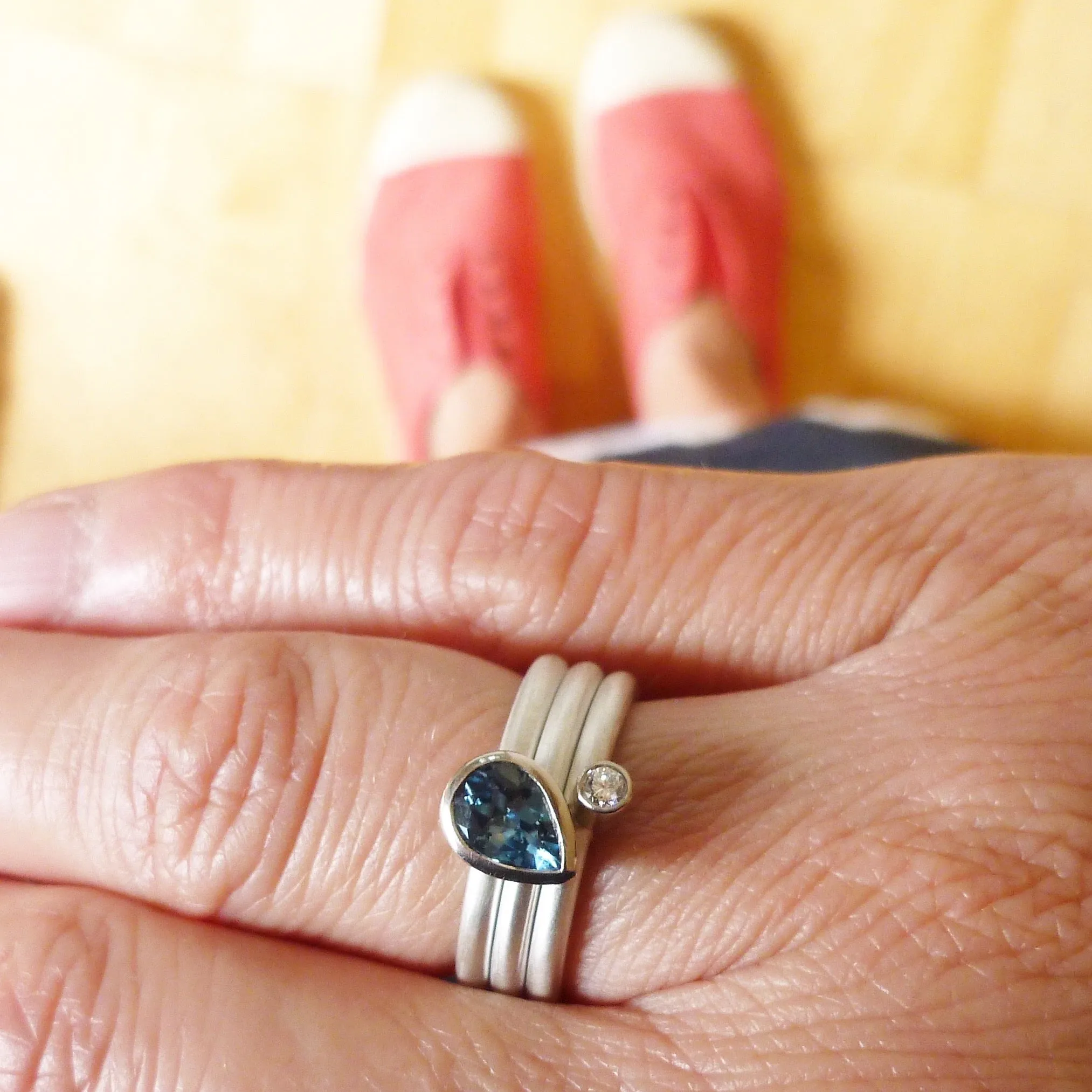 A unique, contemporary aquamarine and diamond gold and silver ring