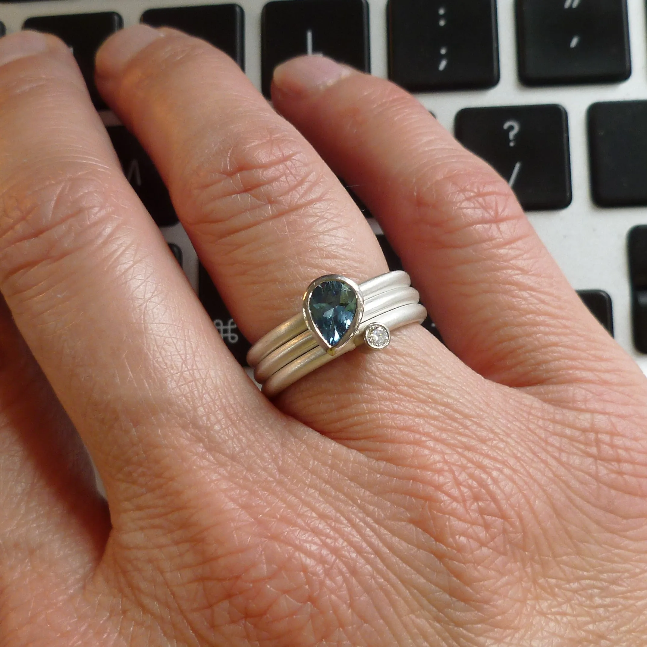 A unique, contemporary aquamarine and diamond gold and silver ring