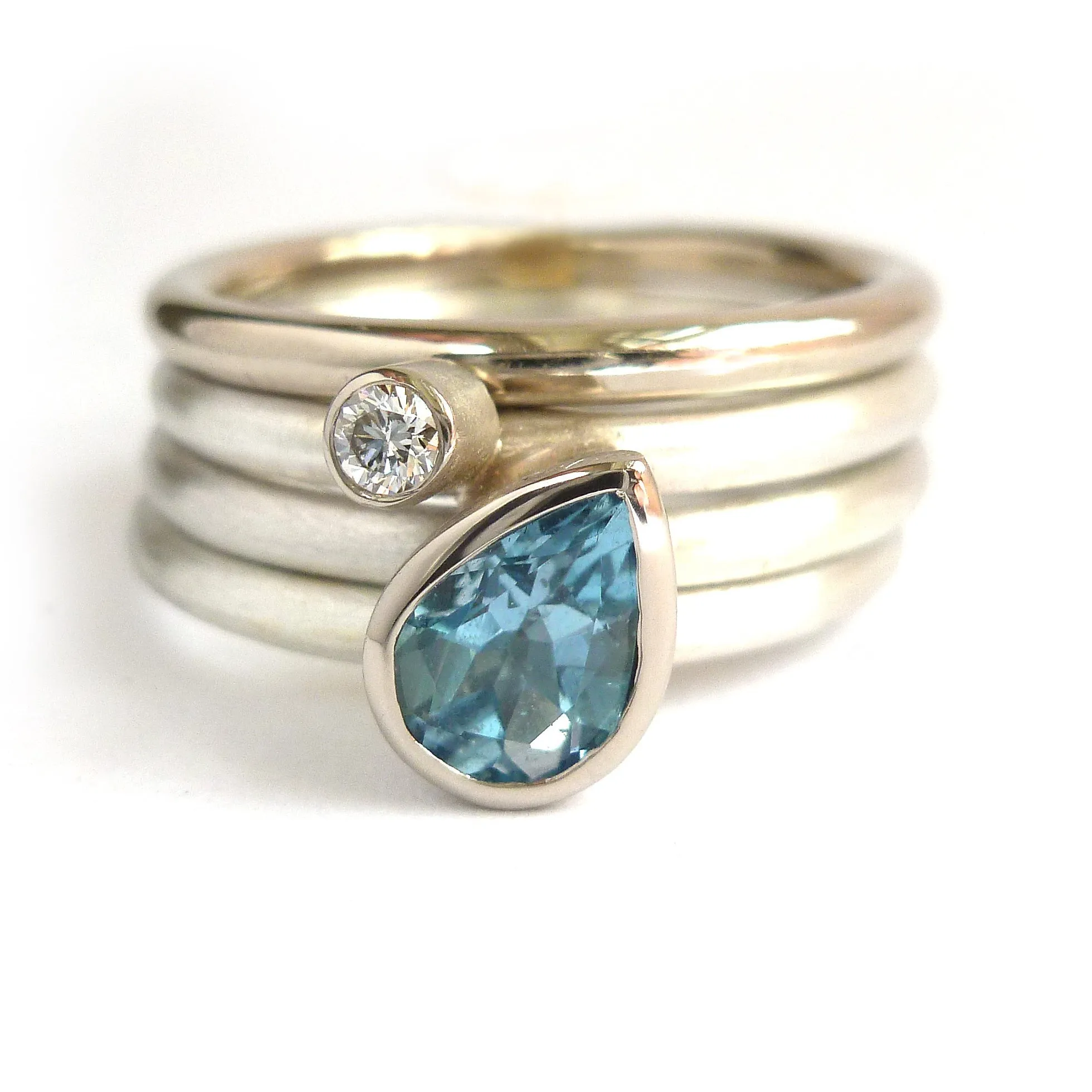 A unique, contemporary aquamarine and diamond gold and silver ring