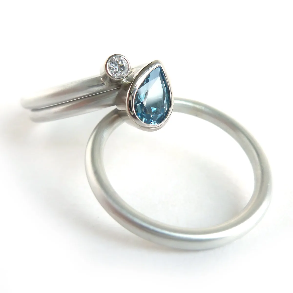 A unique, contemporary aquamarine and diamond gold and silver ring