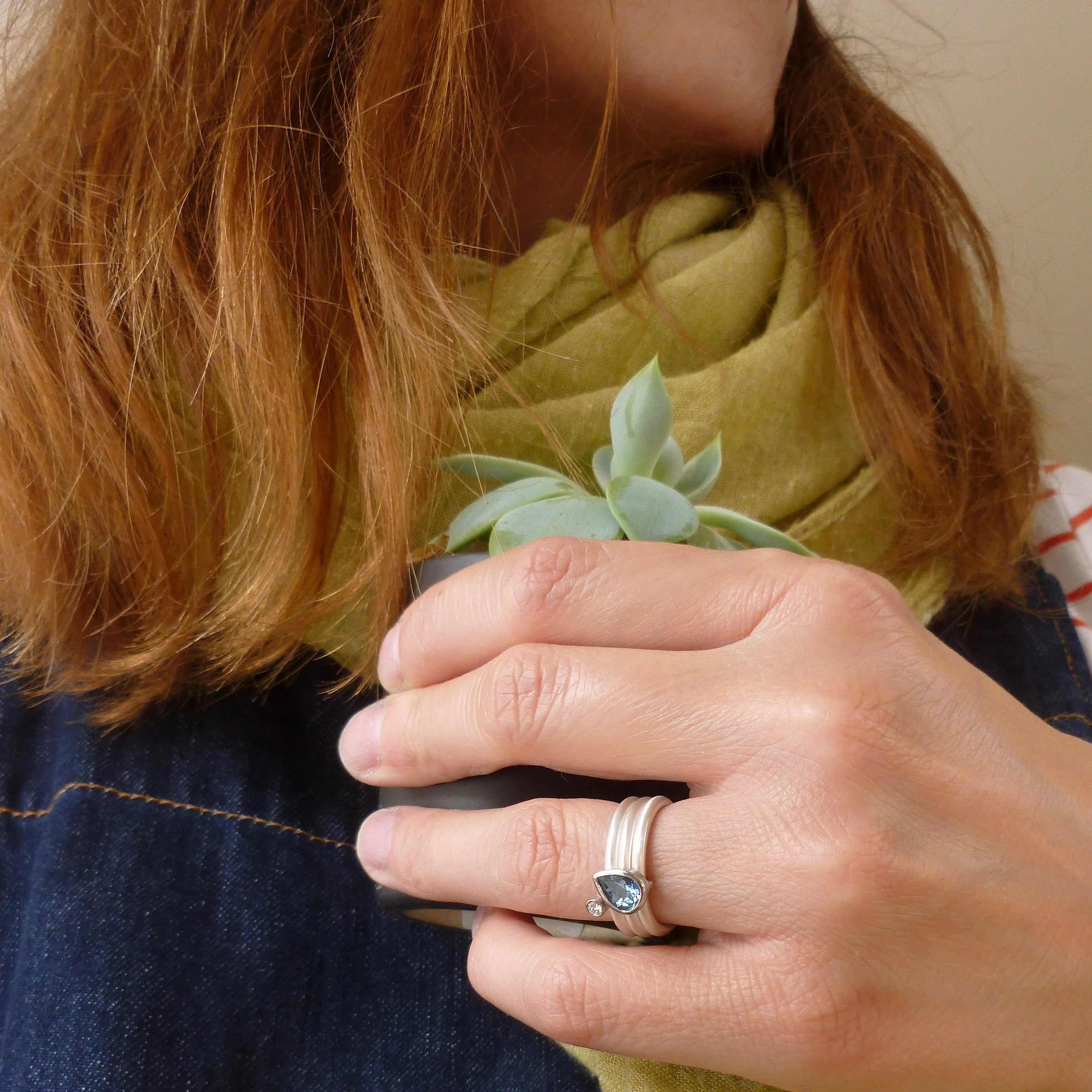 A unique, contemporary aquamarine and diamond gold and silver ring