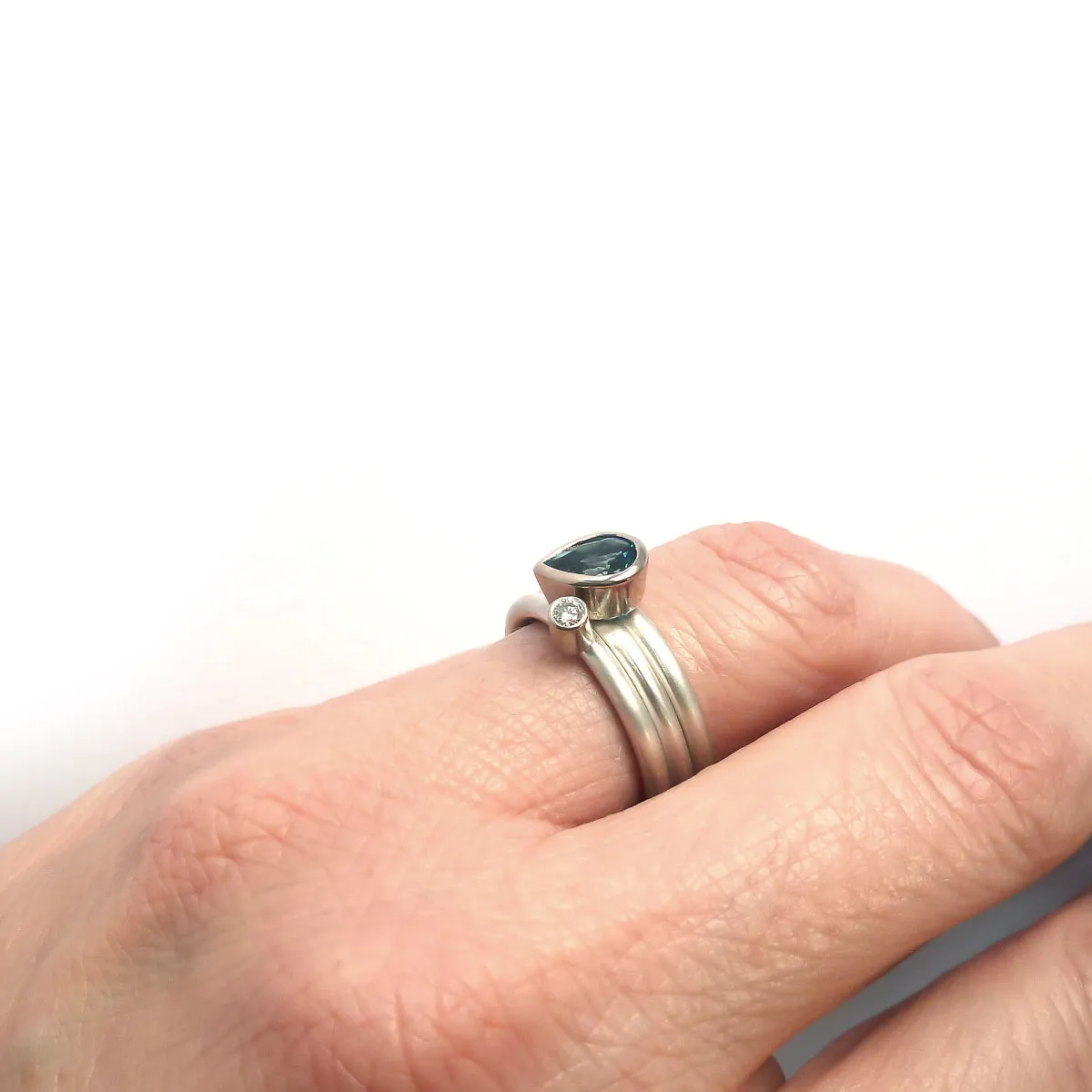 A unique, contemporary aquamarine and diamond gold and silver ring