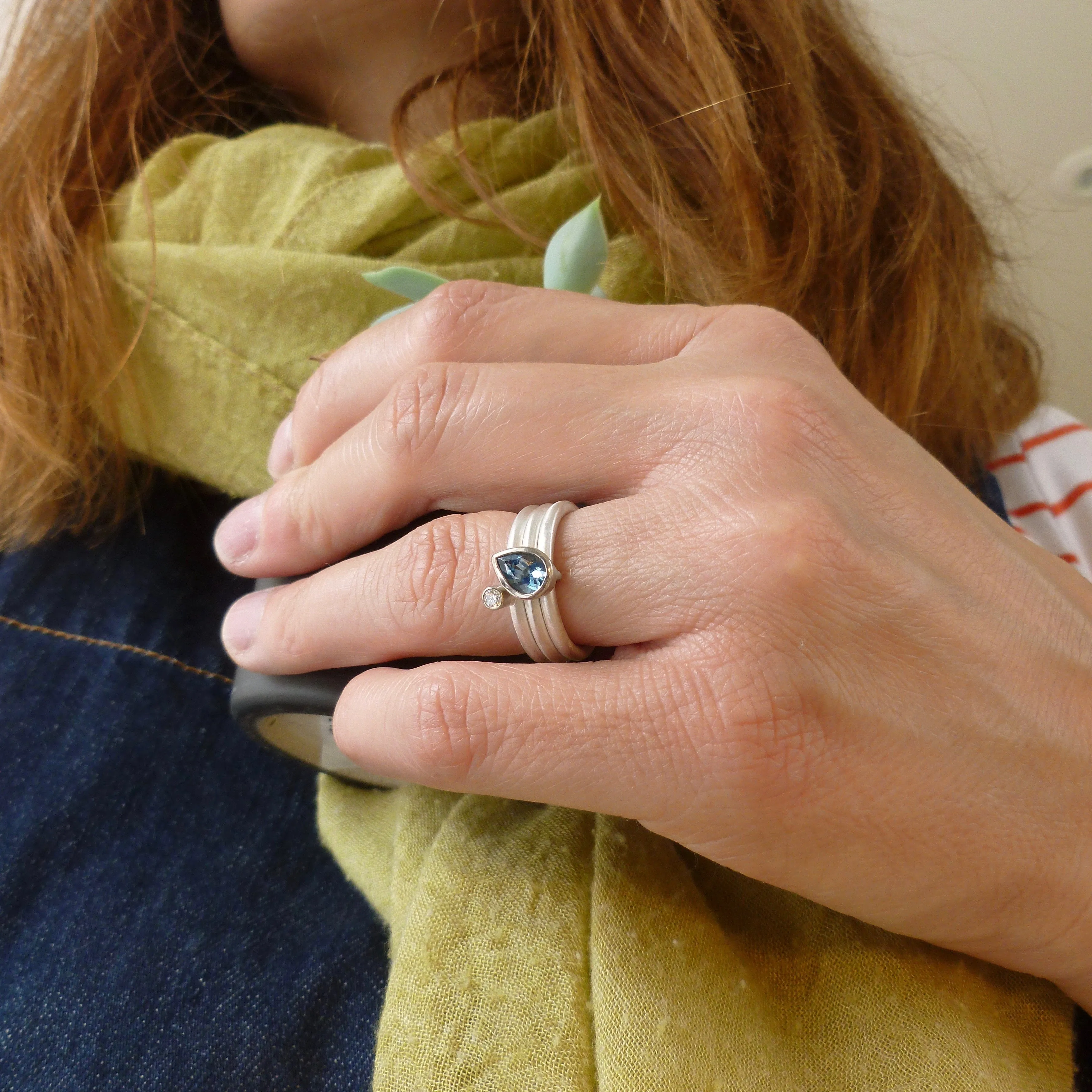A unique, contemporary aquamarine and diamond gold and silver ring