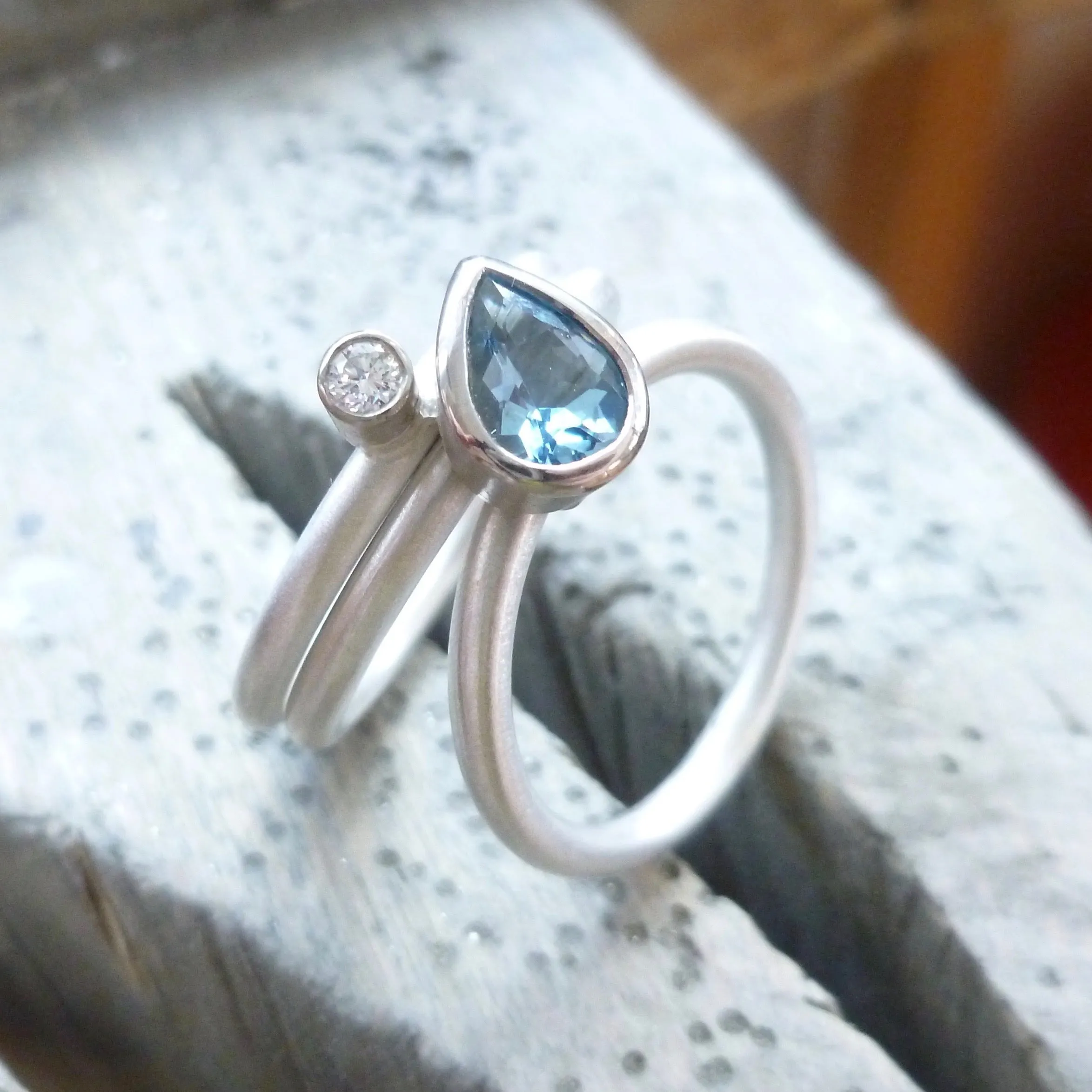A unique, contemporary aquamarine and diamond gold and silver ring