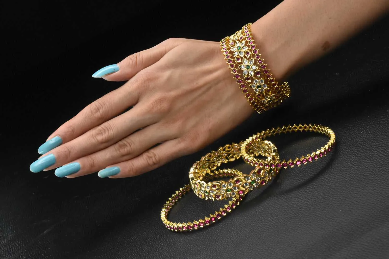Beautiful composition of  Ruby emralds with American diamonds Bangles set
