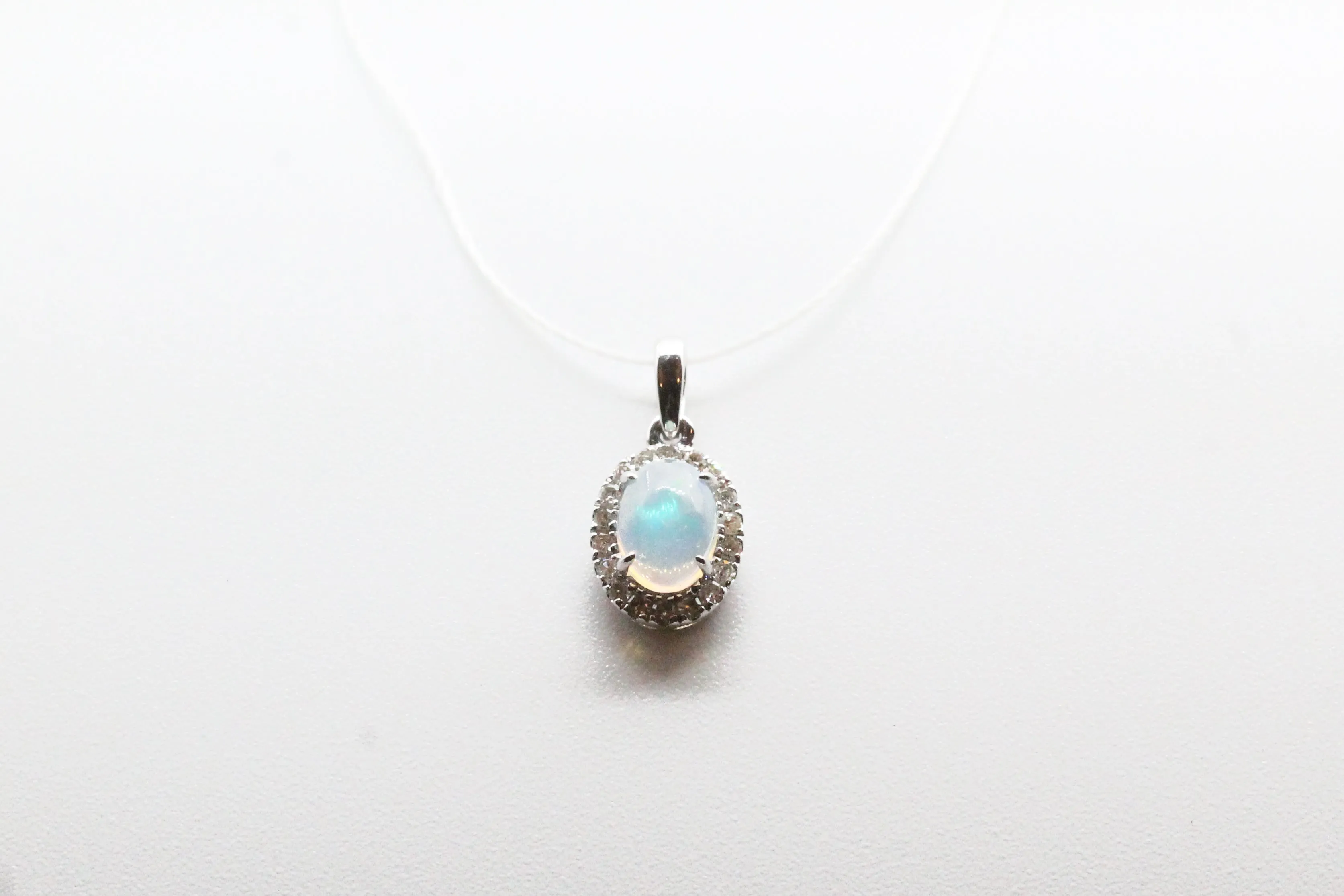White Gold Oval Opal Halo Pendant
